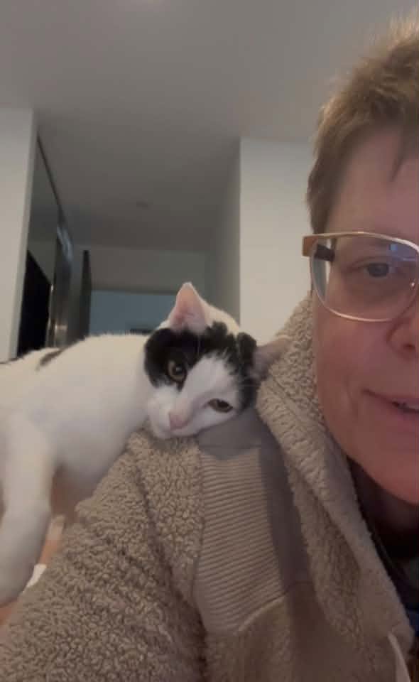 Millie beside a person in glasses